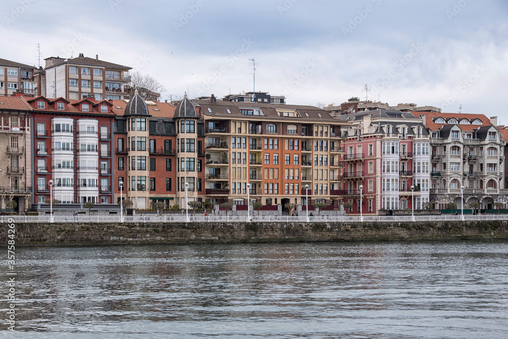 Houses with colored facades at the mouth of the Ria de Bilbao in Portugalete, Biscay, Basque Country, Spain, Europe.