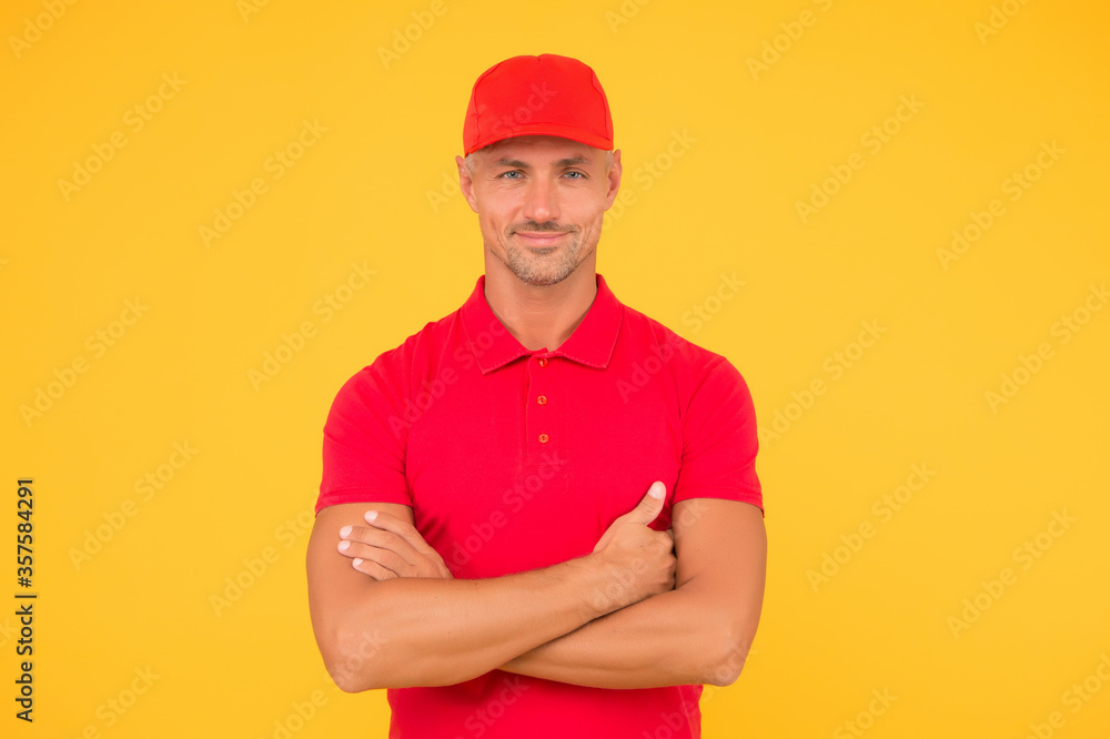 Cool and confident. Confident man keep arms crossed yellow background. Confident look of fashion model Happy guy smile with confidence. Casual style. Mens wardrobe. Confident and positive