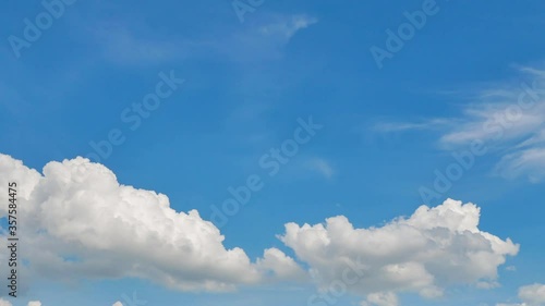 Timelapse of Clouds and Blue Sky. Puffy fluffy white clouds. Cumulus cloud scape timelapse. Summer blue sky time lapse