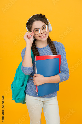 Teen with backpack. Cute smiling schoolgirl. Girl little schoolgirl carry backpack. Pupil going to school. Modern schoolgirl daily life. School club. School system functions. Private schooling