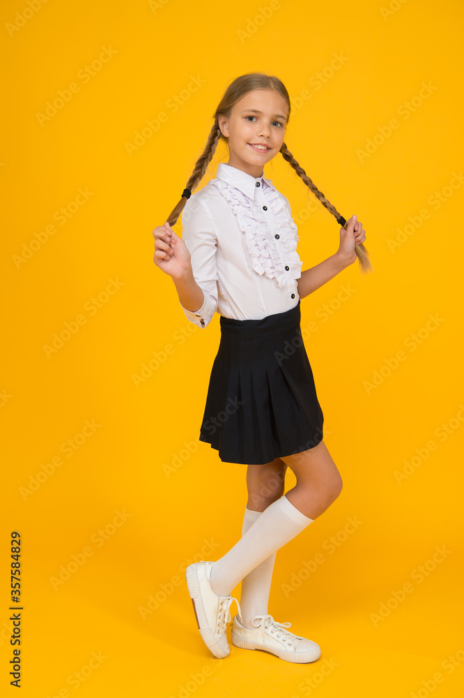 Welcome back to school. Small schoolgirl with happy smile. Little schoolgirl looking nice in school uniform. Cute schoolgirl with long hair. Graduation concept. Primary education. Perfect schoolgirl Welcome back to school. Small schoolgirl with happy smile. Little schoolgirl looking nice in school uniform. Cute schoolgirl with long hair. Graduation concept. Primary education. Perfect schoolgirl