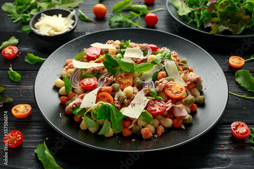 Mini potato gnocchi tricolour with tomato, spinach, Seasonal salad leaves and parmesan cheese