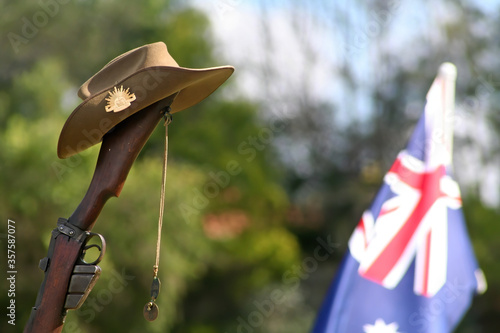 ANZAC Day. Australia National Day. Rifle with Australian flag, dogtags and slouch hat. Remembrance Day. Veterans Day.  Lest we forget concept.