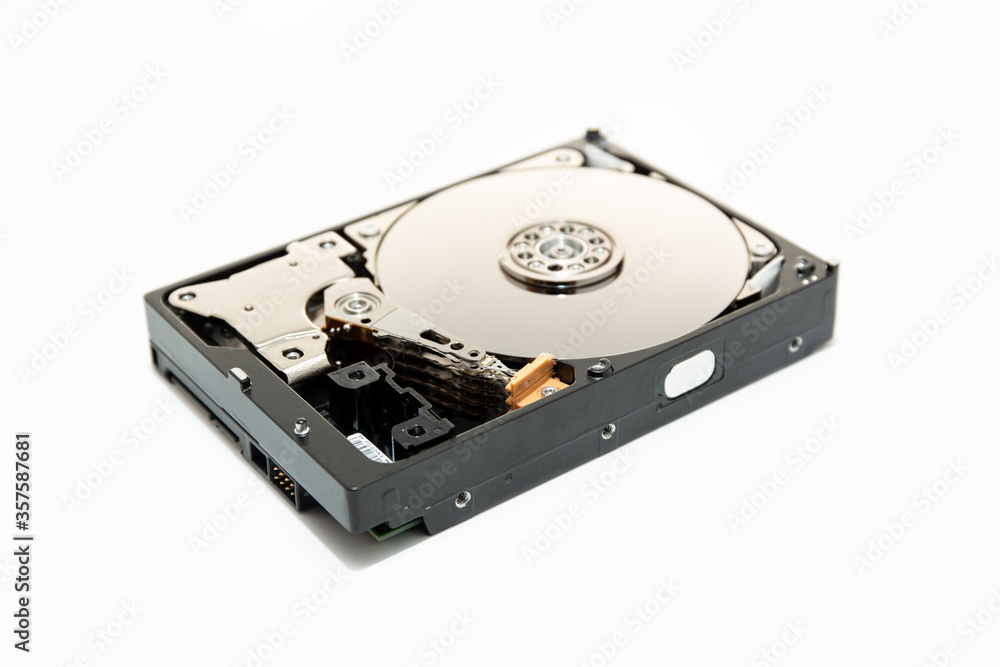 Open Hard disk drive HDD isolated on white background. Computer hardware data storage. Open Hard disk drive HDD isolated on white background. Computer hardware data storage.