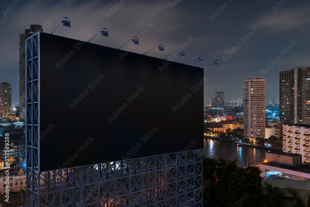Blank black road billboard with Bangkok cityscape background at night time. Street advertising poster, mock up, 3D rendering. Side view. The concept of marketing communication to promote idea. Blank black road billboard with Bangkok cityscape background at night time. Street advertising poster, mock up, 3D rendering. Side view. The concept of marketing communication to promote idea.