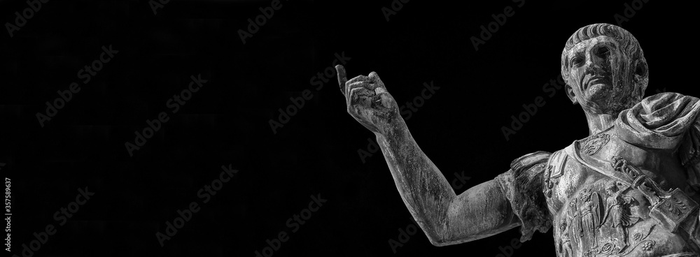 Trajan the conqueror, one of the greatest ancient roman emperor, bronze statue along Imperial Fora avenue in the very center of Rome (Black and White with copy space) Trajan the conqueror, one of the greatest ancient roman emperor, bronze statue along Imperial Fora avenue in the very center of Rome (Black and White with copy space)