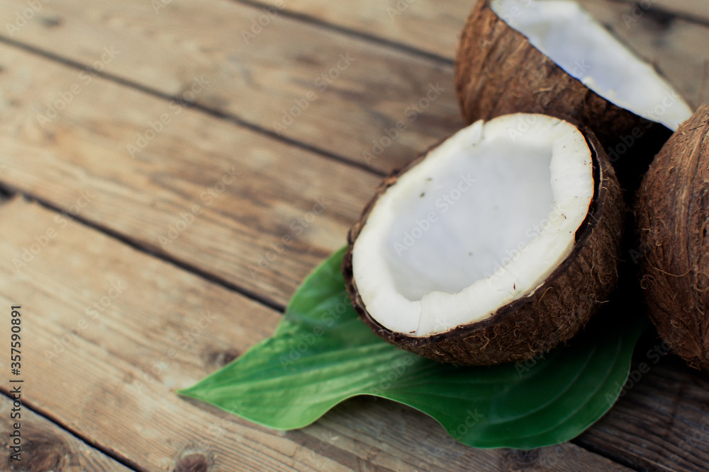 Coconut on wooden table. Organic healthy food concept.Beauty and SPA concept. Coconut on wooden table. Organic healthy food concept.Beauty and SPA concept.