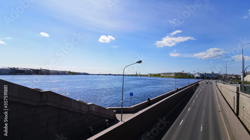 View from the bridge in St. Petersburg on the wide river and the city on the water. Traveling in Russia. © realone952