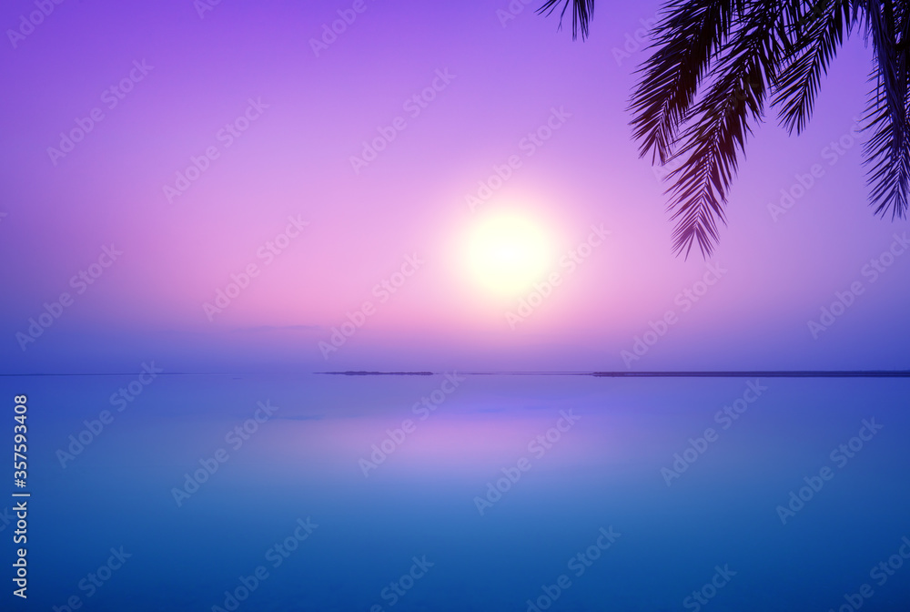Dead Sea in the early morning. Wild nature. Tropical minimalist landscape. Sunrise over the sea. Summertime