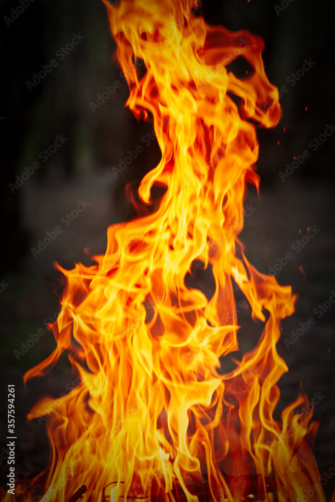 Long tongues of camp fire outside Long tongues of camp fire outside