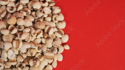 Job's Tears, also known as adlay and coix on red background. Popular in Asian cultures as a food source.