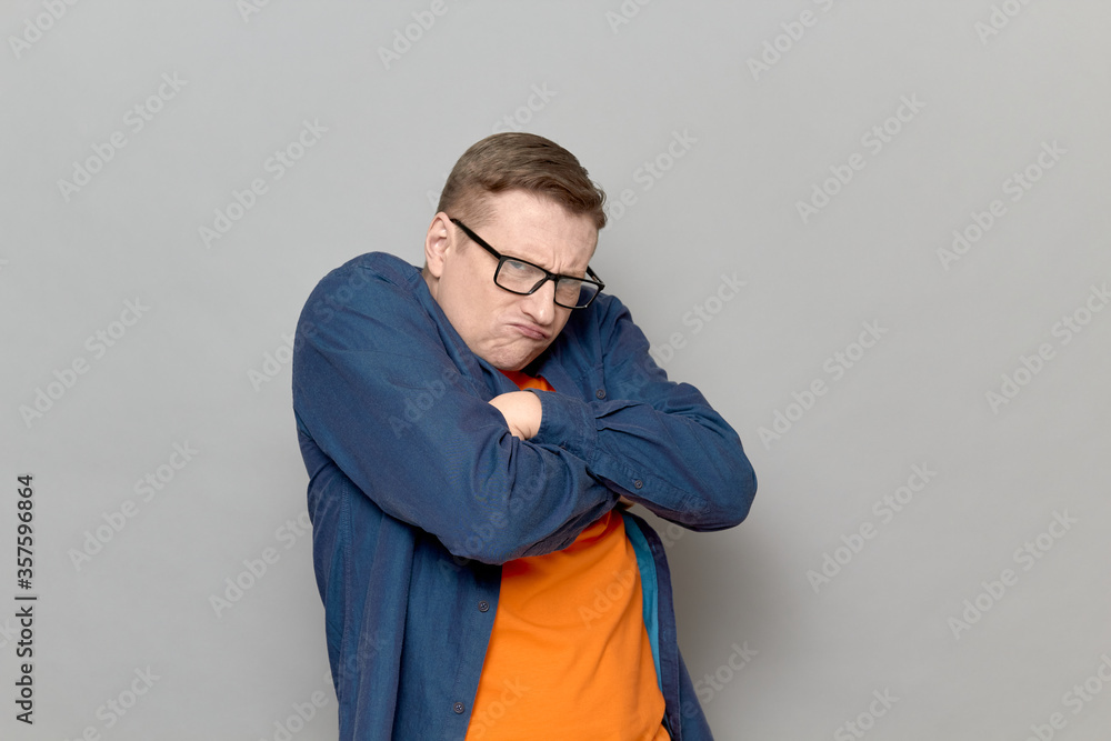Fototapeta premium Portrait of funny angry resentful man feeling grudge and displeasure