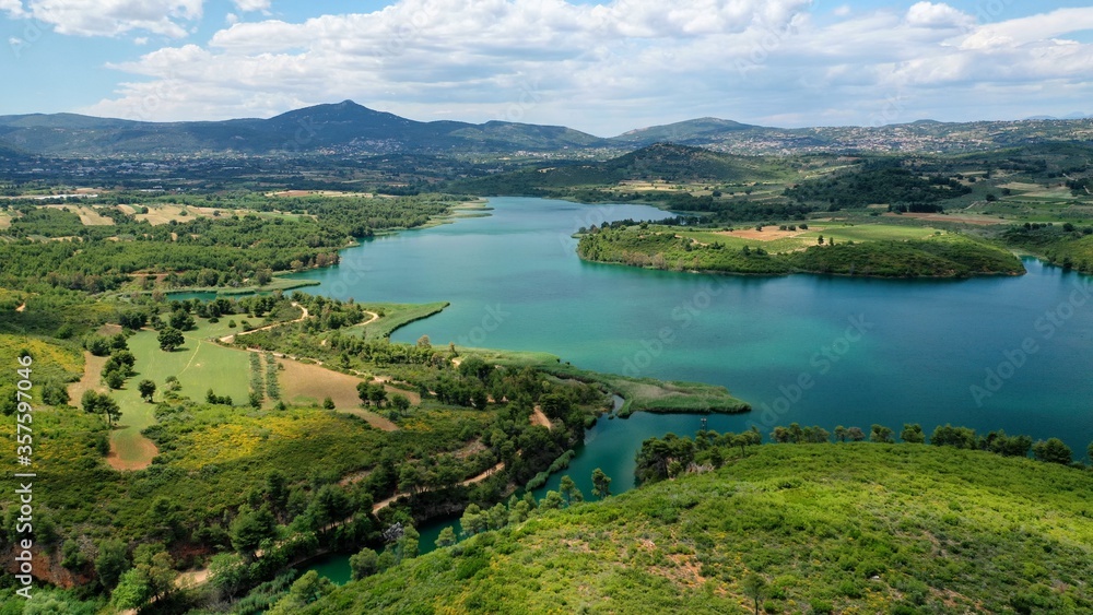 Aerial drone panoramic photo of beautiful nature in artificial lake and dam of Marathonas or Marathon that feeds drinking water supply to Athens, Attica, Greece Aerial drone panoramic photo of beautiful nature in artificial lake and dam of Marathonas or Marathon that feeds drinking water supply to Athens, Attica, Greece