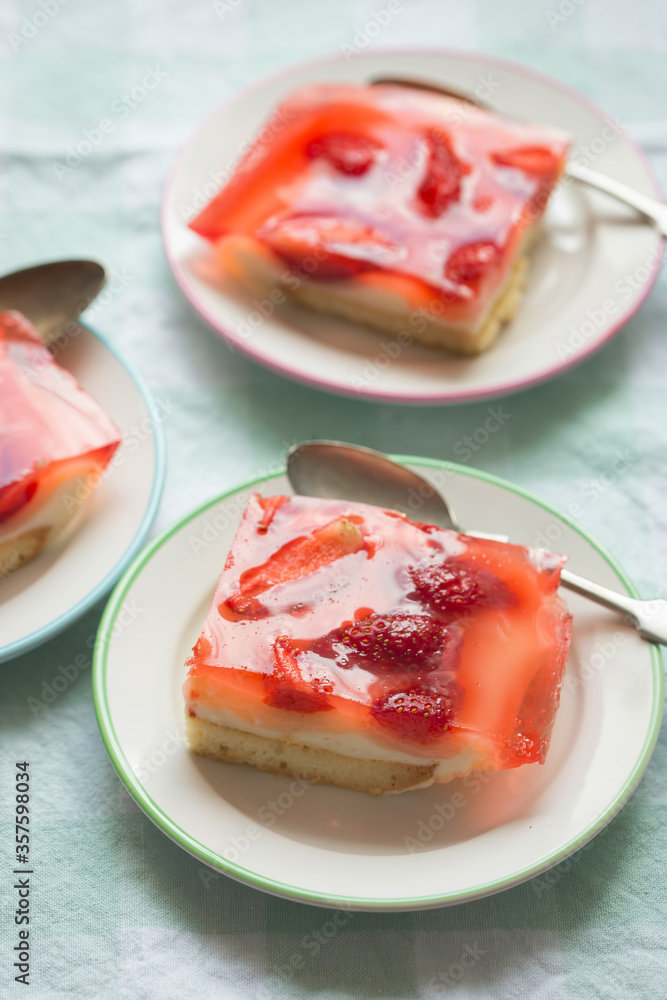 Sponge cake with yoghurt and lemon layers with strawberries and jelly Sponge cake with yoghurt and lemon layers with strawberries and jelly