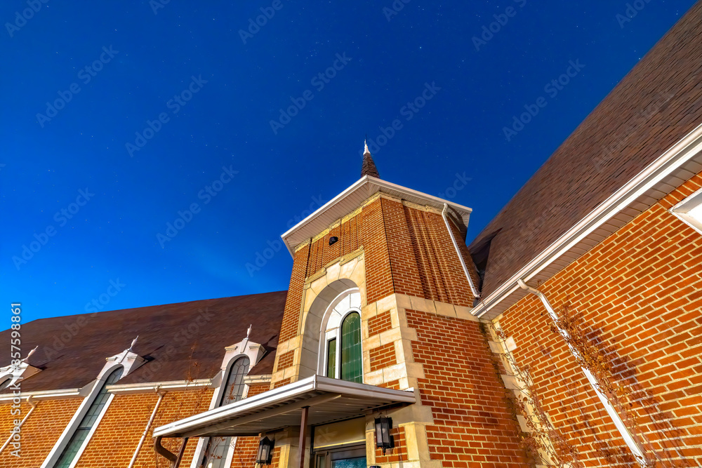Exterior of a church in Provo Utah with brick wall under vivid clear blue sky