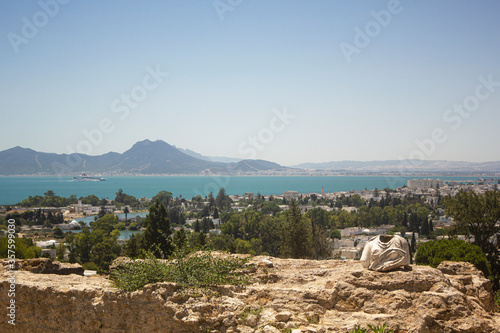 Ancient ruins at Carthage, Tunisia with the Mediterranean Sea. View from hill Byrsa with ancient remains of Carthage and landscape. Tunis, Tunisia.