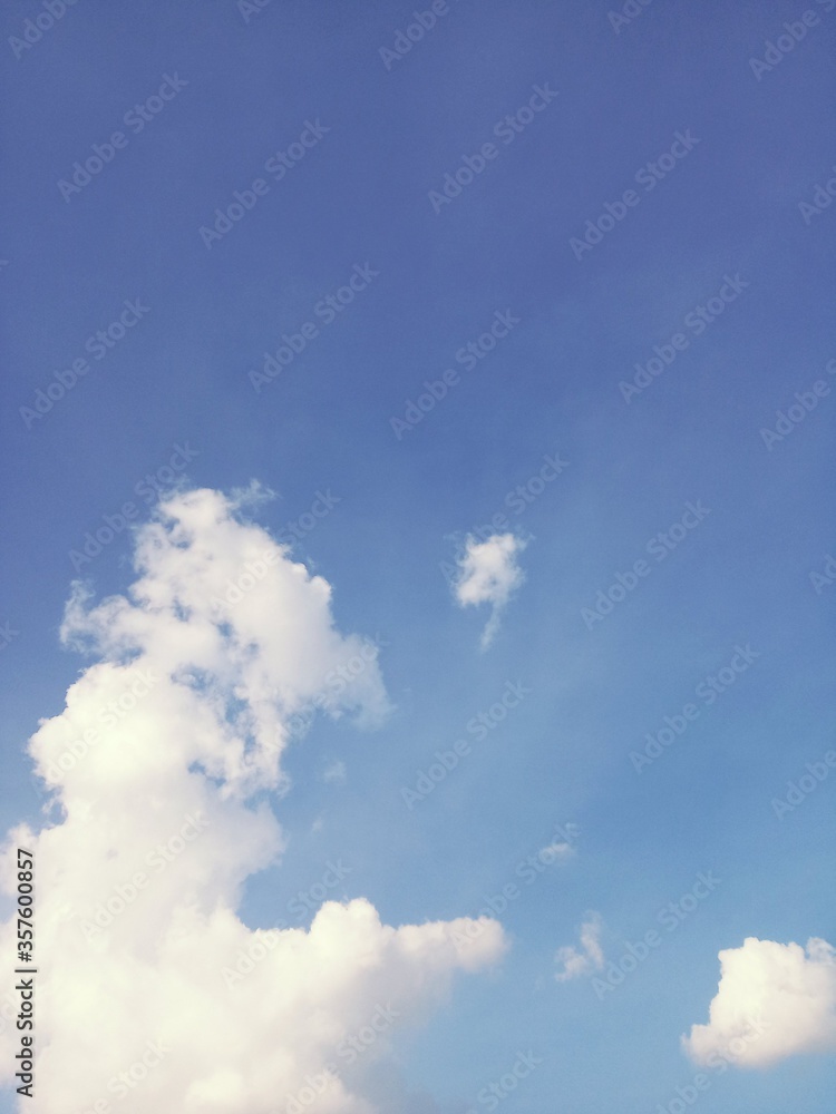 Natural wallpaper of white clouds in the sky. Abstract background. Natural wallpaper of white clouds in the sky. Abstract background.