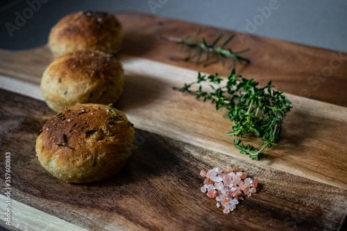 Baked bread rolls with herbs and salt.