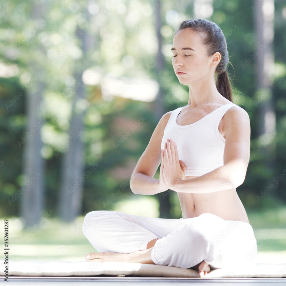 Fototapeta premium Yoga woman in white outdoor