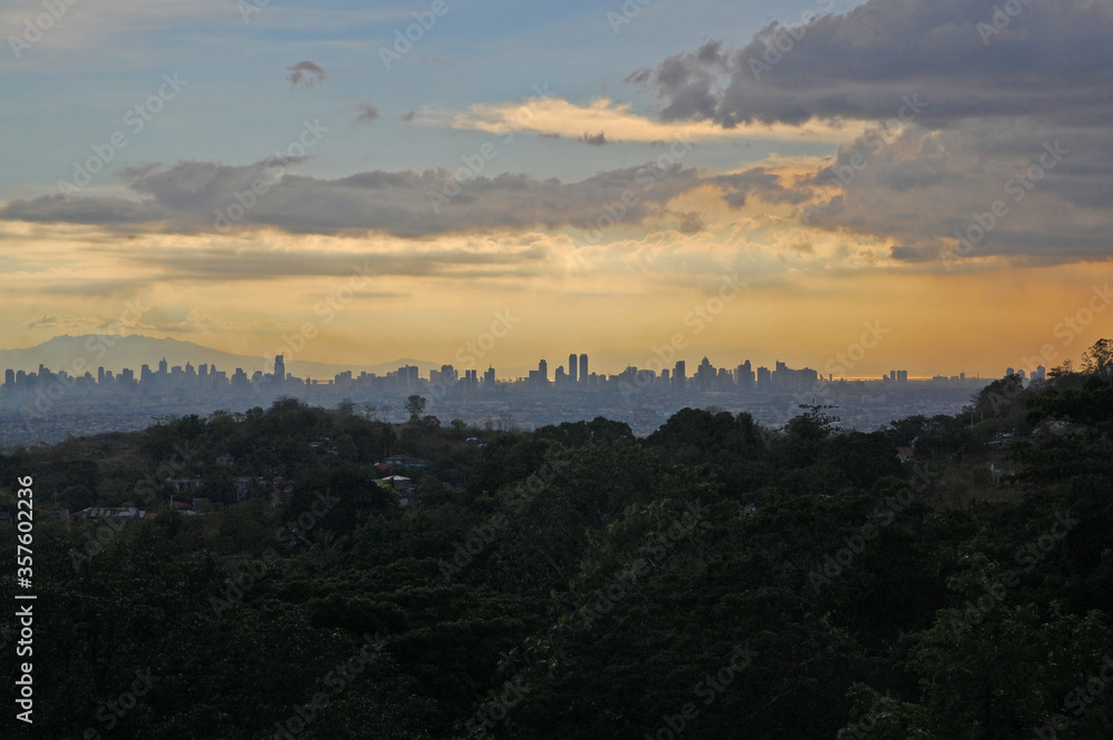City overview of Metro Manila at sunset in Antipolo, Rizal, Philippines