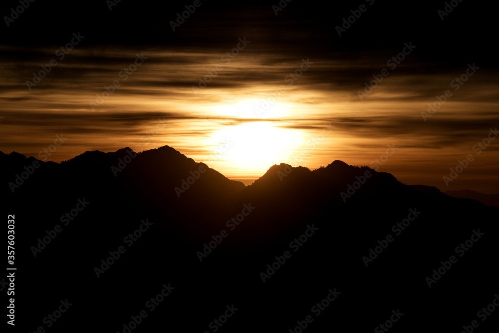 silhouette landscape view of sunrise over the mountains 