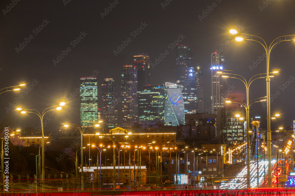 Moscow city skyline and blurred traffic at twilight