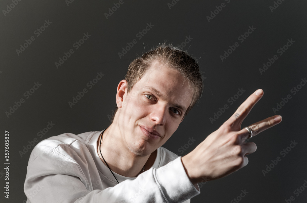 Portrait of young blond man photographed with natural light and casual clothes. Portrait of young blond man photographed with natural light and casual clothes.