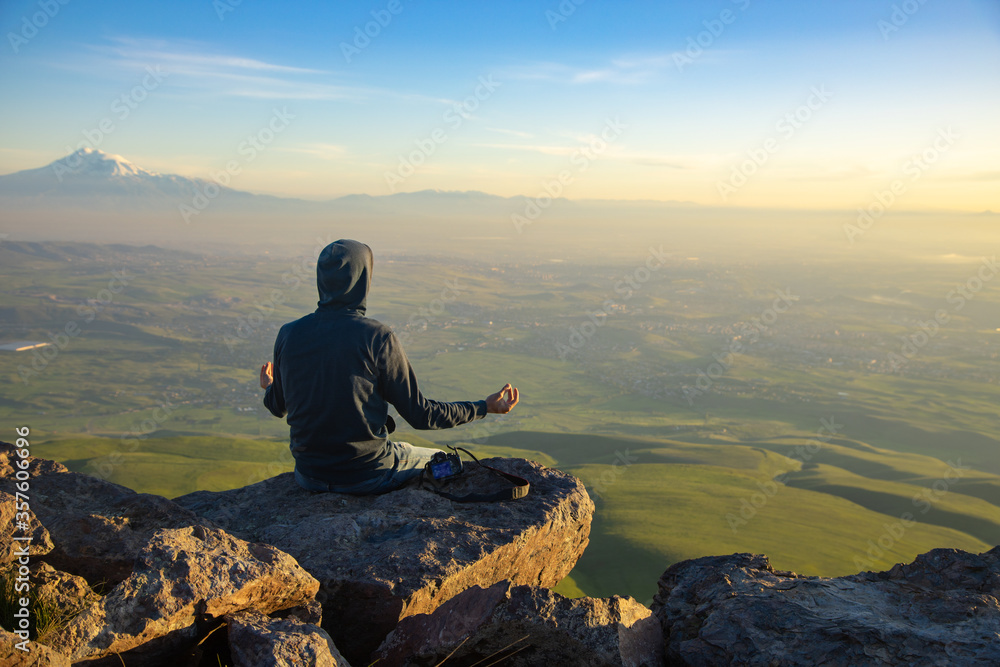 meditating man  in the mountain
