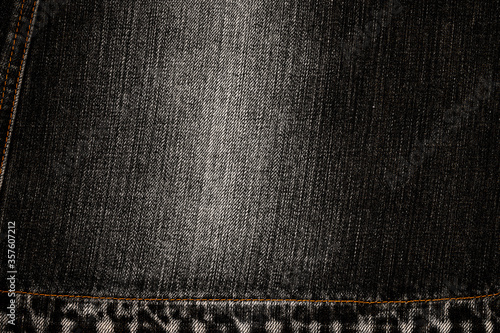 Denim jeans cloth in trendy used look design. Bleached scratched fabric backdrop - stock image