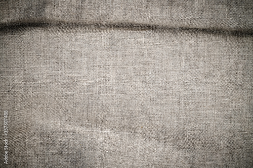 Natural linen texture. Stone washed pure linen texture. Wrinkled linen fabric background.
