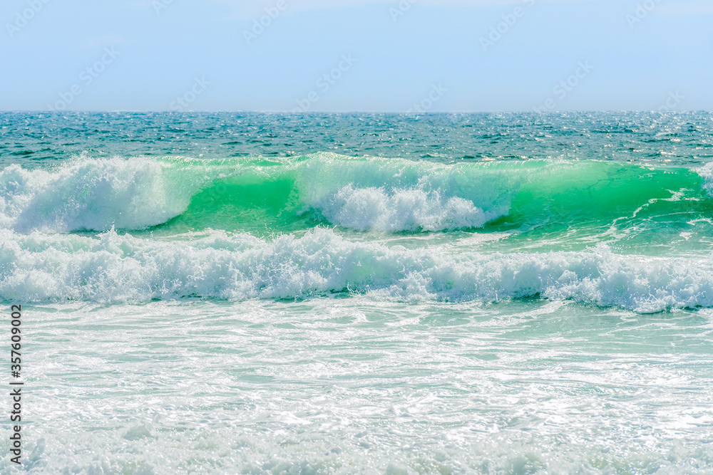 sea waves with white breakers running ashore, bright sunny day, beautiful natural landscape sea waves with white breakers running ashore, bright sunny day, beautiful natural landscape