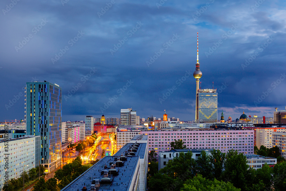 Berlin sunset cityscape aerial view with tv tower in heavy storm conditions