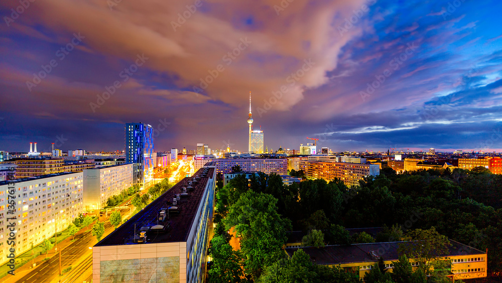 Berlin sunset cityscape aerial view with tv tower in heavy storm conditions