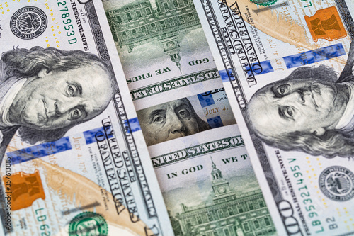 Wallpaper Mural Benjamin Franklin peeking through 100 dollar banknotes Torontodigital.ca