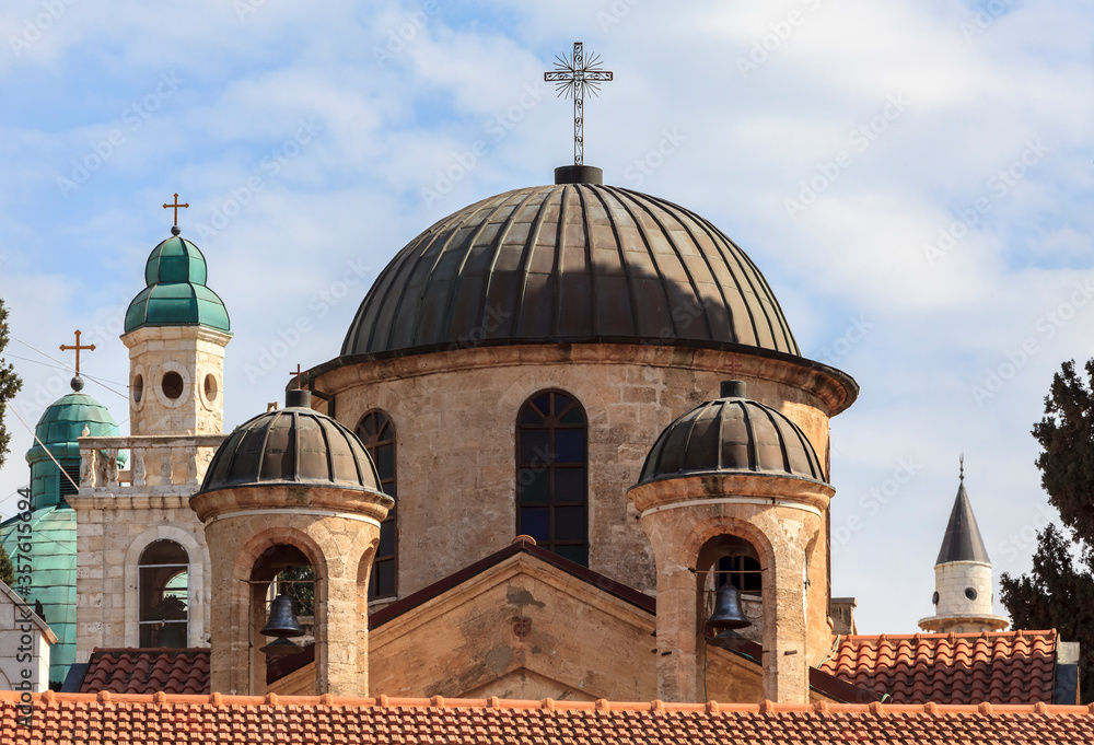 The dome of the Orthodox Church and the Muslim minaret. Church of St. George in Kafr Kanna, Nazareth, Israel.