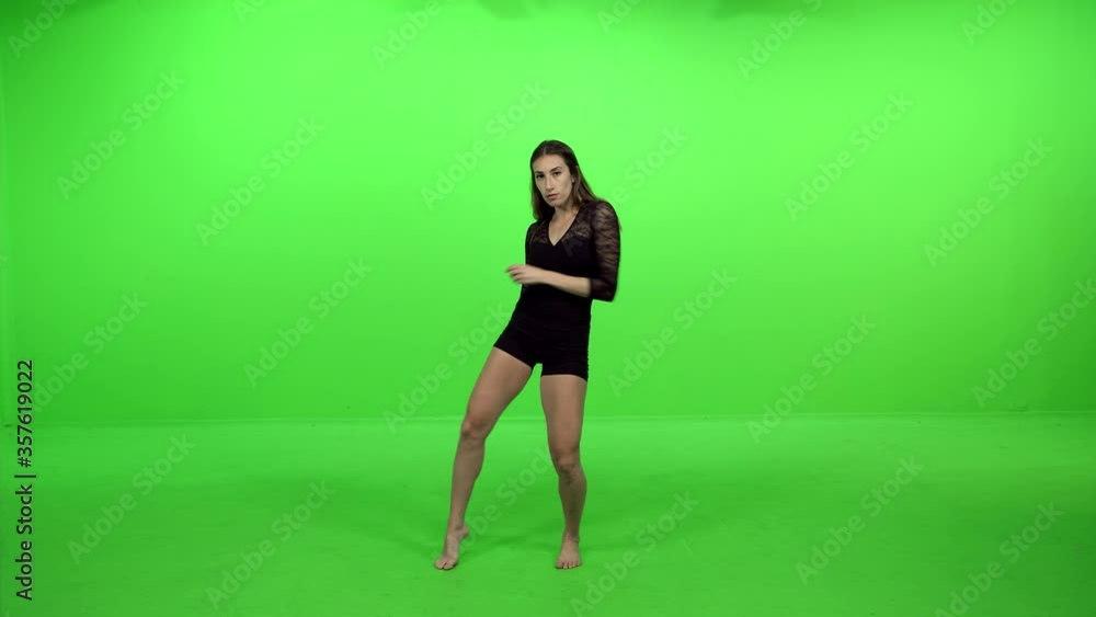 Professional dancer performs over green screen, slow tempo, smooth movements. Professional dancer performs over green screen, slow tempo, smooth movements.