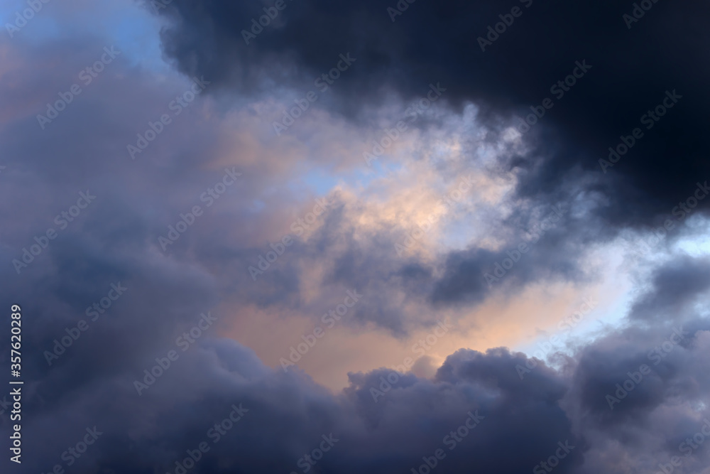 Colorful big fluffy clouds. Natural scenic abstract background. Weather changes backdrop. Sky filled with voluminous clouds.