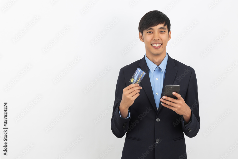 Young handsome asian business man using smartphone for online payment with smiling isolated on white background. Young handsome asian business man using smartphone for online payment with smiling isolated on white background.