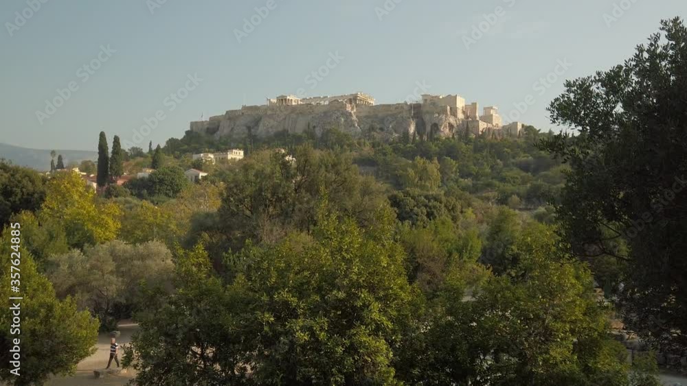 Scenic view of the Acropolis of Athens and the Parthenon, between beautiful forest. Unesco World Heritage site Scenic view of the Acropolis of Athens and the Parthenon, between beautiful forest. Unesco World Heritage site