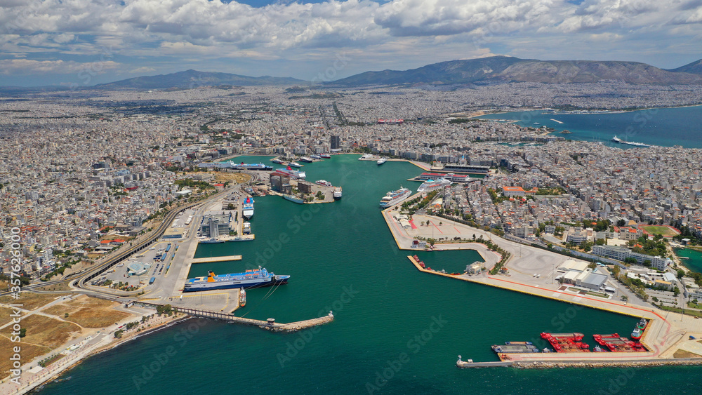 Aerial drone panoramic photo of famous port of Pireus or Piraeus where passenger ferries and cruises travel to popular Aegean island destinations as seen from high altitude, Attica, Greece