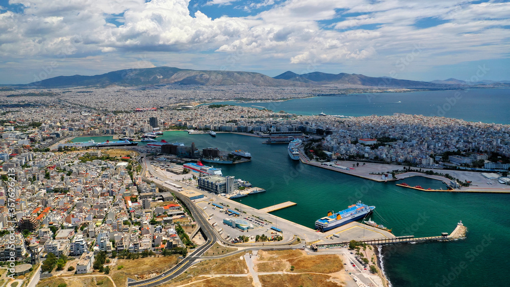 Aerial drone panoramic photo of famous port of Pireus or Piraeus where passenger ferries and cruises travel to popular Aegean island destinations as seen from high altitude, Attica, Greece