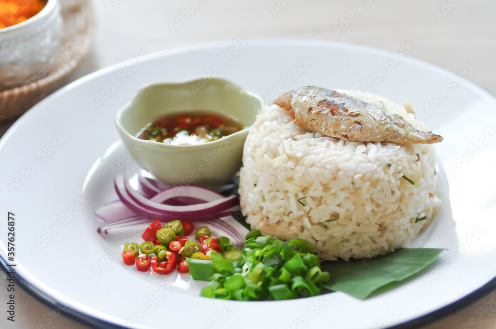 fried rice or stir-fried rice with fish, rice topped with fish