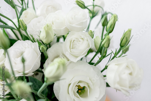 Bouquet of white flowers on white background