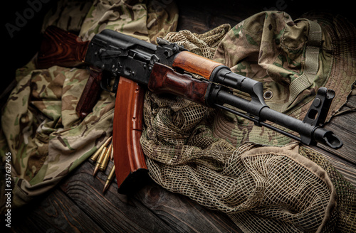 Classic Soviet AK machine gun on a wooden back. Weapons of Russia and the Soviet Union.