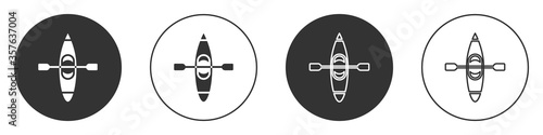 Black Kayak and paddle icon isolated on white background. Kayak and canoe for fishing and tourism. Outdoor activities. Circle button. Vector Illustration.