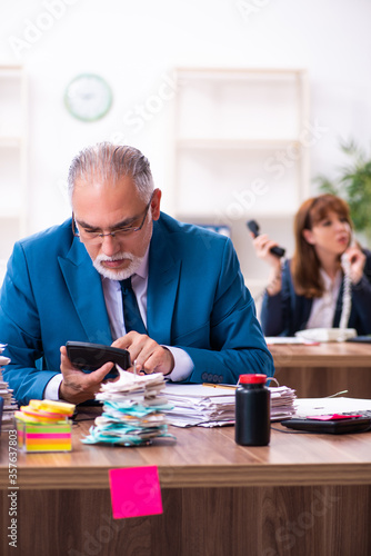 Two employees and excessive work in the office