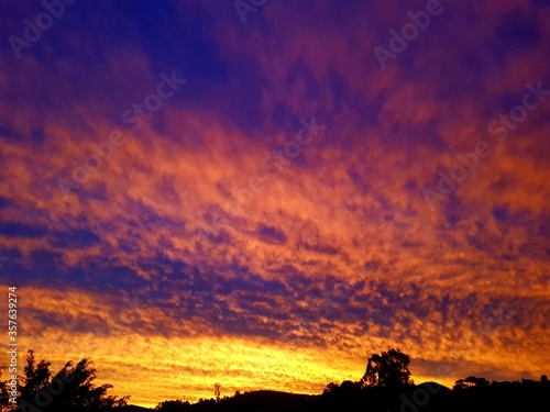 Colorful sunset. Amazing landscape with colorful vivid sunset on the bright sky.