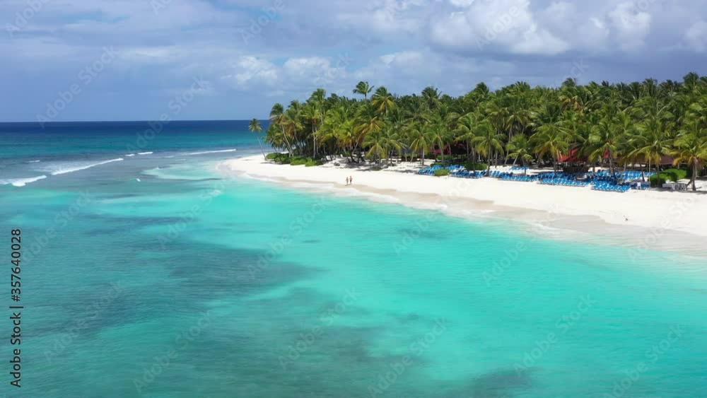 Tropical shore with coconut palm trees and turquoise caribbean sea. Aerial view from copter Tropical shore with coconut palm trees and turquoise caribbean sea. Aerial view from copter
