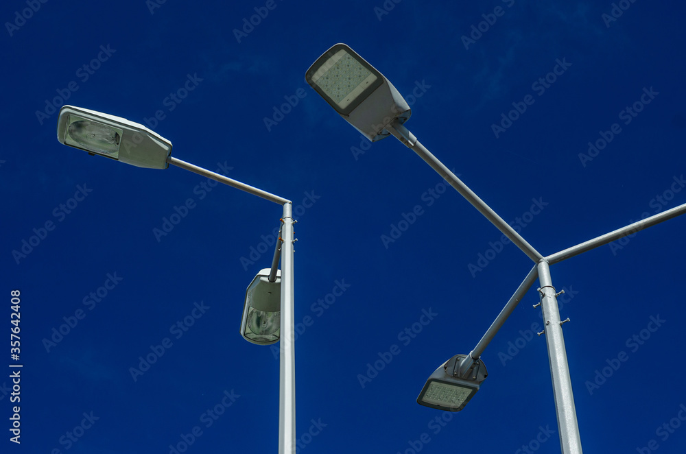 A modern street LED lighting pole. Urban electro-energy technologies. Savings on street urban road lighting. Energy saving. High tech. Eco-friendly smart city system. A modern street LED lighting pole. Urban electro-energy technologies. Savings on street urban road lighting. Energy saving. High tech. Eco-friendly smart city system.