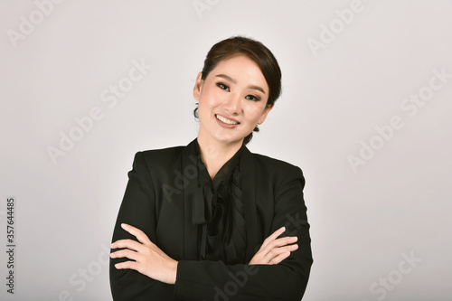 Obraz na płótnie Confident business asian woman isolated in studio shot, Portrait of professional working people with copy space. w salonie